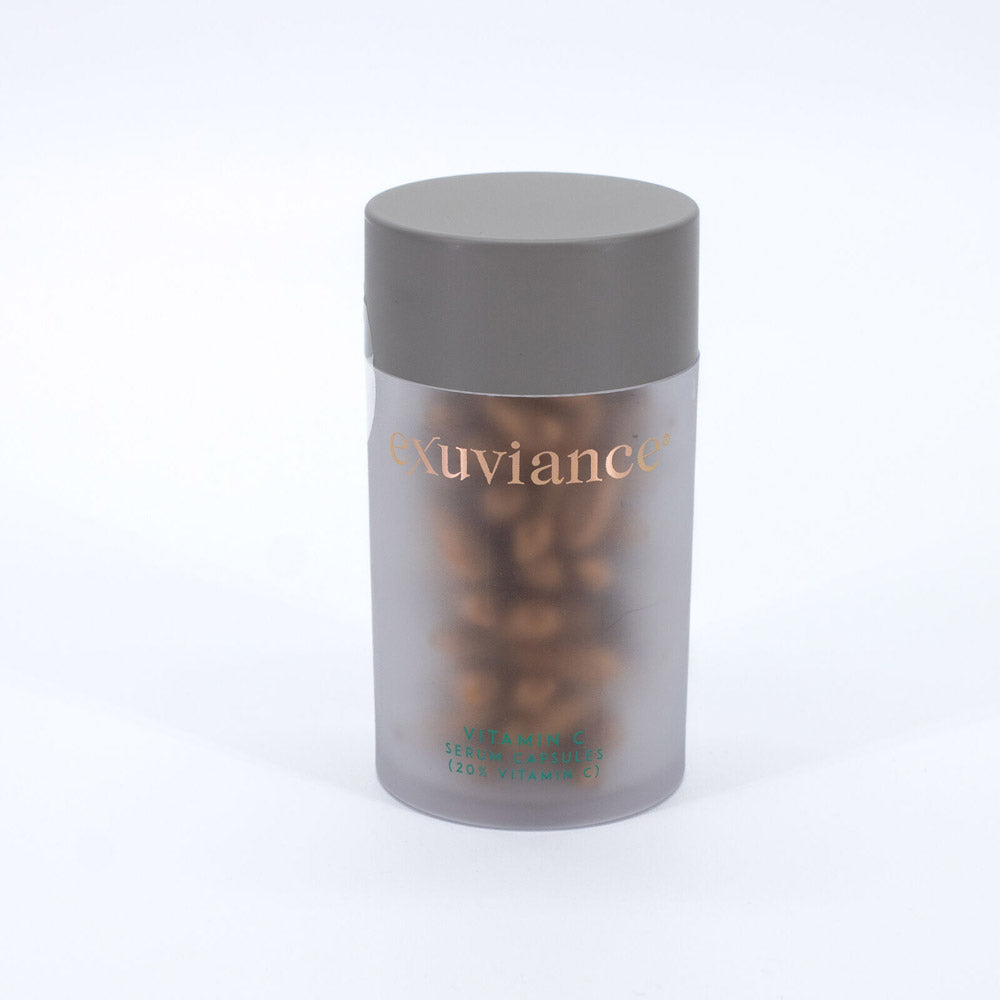 Exuviance Vitamin C 20% Serum jar showcasing anti-aging formula in a sleek container.
